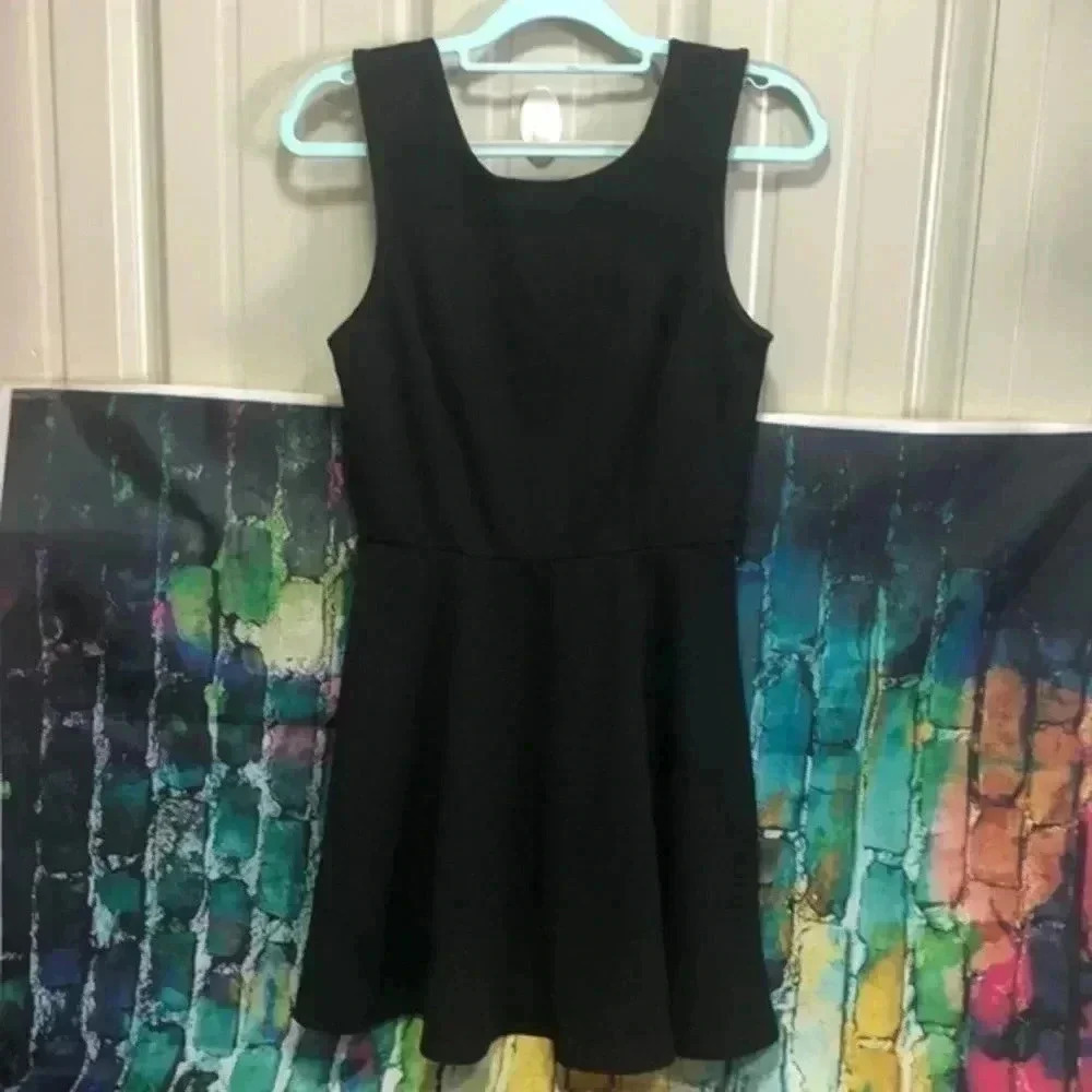 Style rack brand dress black with gold bow accents in back